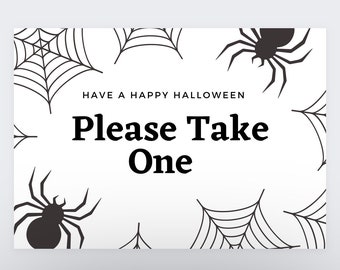 May include: White sign with black spiderwebs and spiders. The sign says "Have a Happy Halloween. Please Take One."