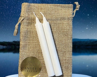 May include: Two white candles in a burlap bag with a gold logo that says "Candle's Friend".