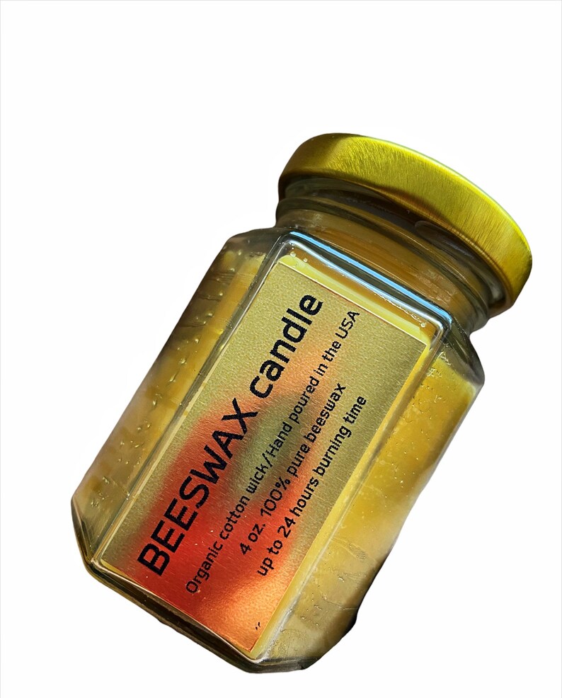 May include: A 4 ounce beeswax candle in a clear glass jar with a gold lid. The candle is hand-poured in the USA and has an organic cotton wick. It is estimated to burn for up to 24 hours.