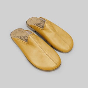 Main view of handmade mustard leather mules for men, showcasing the wide toe box and premium artisan craftsmanship for natural barefoot comfort.
