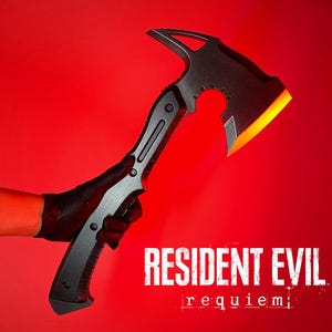 May include: Black axe with a unique design, featuring a curved blade and a toothed edge. The axe has a black handle and a bright orange blade edge. The image includes the text "RESIDENT EVIL requiem" in white.