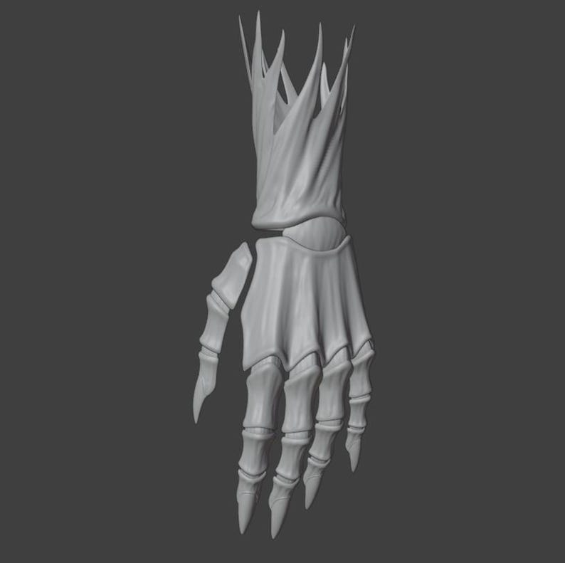 May include: A gray, 3D-rendered skeletal hand with a crown-like structure at the wrist. The hand is detailed, with visible bones and sharp, pointed fingertips. The background is a solid gray.