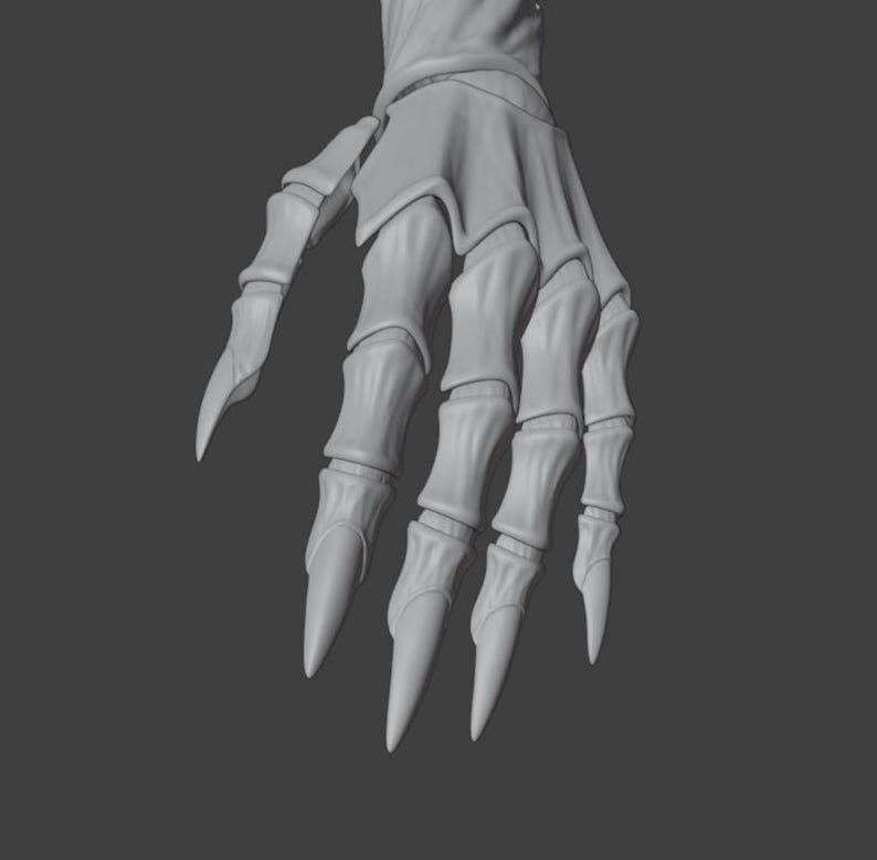 May include: A grayscale image of a skeletal hand with long, pointed fingernails. The hand is in a downward position, with the fingers slightly curved. The bones are detailed, and the overall effect is a gothic or fantasy theme.