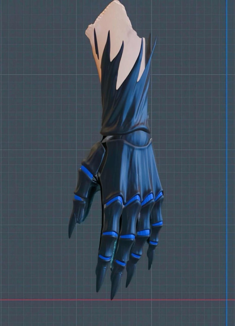 May include: A dark blue, stylized hand with sharp, pointed fingers and blue accents. The hand appears to be a costume or prop, with a detailed design and a textured appearance. The wrist area has a light beige color.