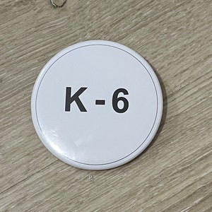 Oppenheimer K-6 Badge Oppenheimer Security Badge