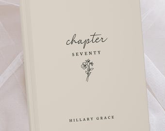 May include: A cream-colored book with the word "chapter" in cursive script at the top. Below, the word "SEVENTY" is centered, with a small floral illustration beneath it. The author's name, "HILLARY GRACE," is at the bottom.