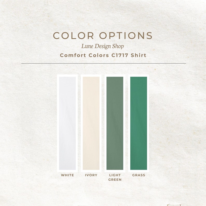 Peut inclure: Options de couleurs pour une chemise en blanc, ivoire, vert clair et vert herbe. Le texte "Lune Design Shop" et "Comfort Colors C1717 Shirt" est affich&eacute; au-dessus des &eacute;chantillons de couleurs.