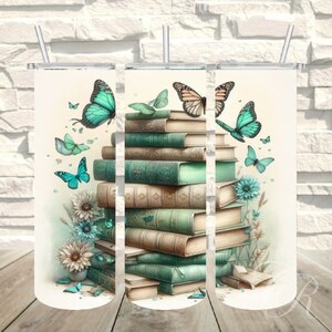 May include: Three stainless steel tumblers with lids, featuring a stack of vintage books and butterflies in shades of blue and green. The tumblers are perfect for enjoying your favorite beverages.