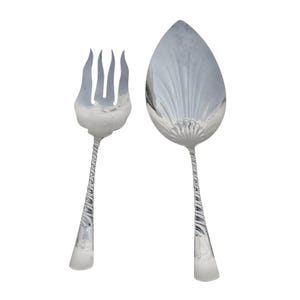 May include: A silver-toned serving set consisting of a four-pronged fork and a large, pointed, shell-shaped spoon. Both utensils feature a distinct, spiraled, twisted handle design that tapers toward the base, with a polished, reflective metallic finish.