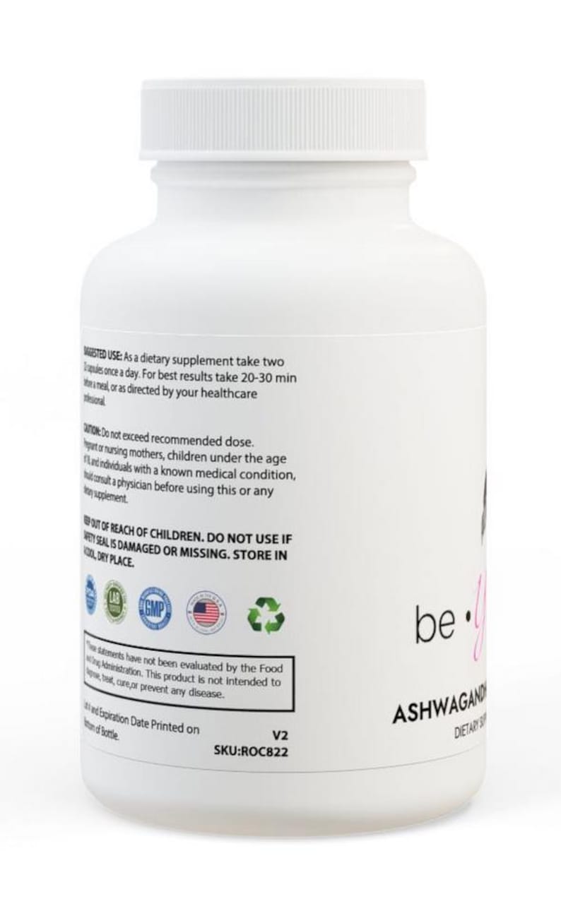 May include: White plastic bottle with a black and pink label that says "be. you" and "ASHWAGANDHA DIETARY SUPPLEMENT". The bottle has a white cap and a label with instructions for use and warnings.