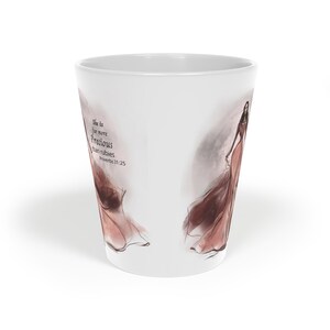 May include: A white conical mug featuring a watercolour-style illustration of a figure in a flowing reddish-brown gown. The text printed on the side reads: She is far more Precious than rubies Proverbs 31:25. The design has a soft, artistic aesthetic.