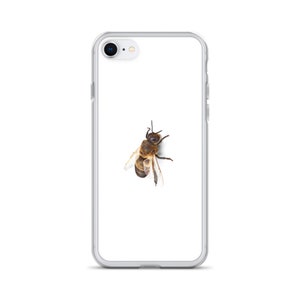 May include: A clear phone case with a bee printed on the back.