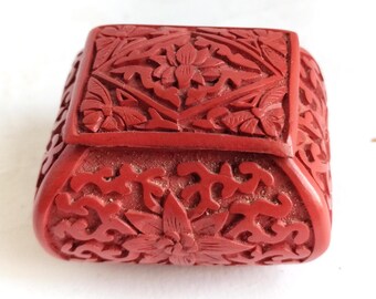 Small cinnabar box with lotus design on lid, stunning turquoise laquer interior