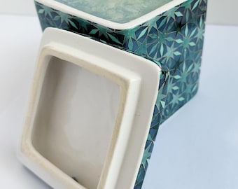 Hand poured and blended candle in square ceramic pot with lid