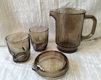 Vintage smoked glass lidded pitcher with two glasses