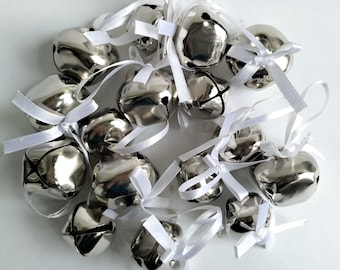 Set of 16 vintage jingle bells on white satin ribbon