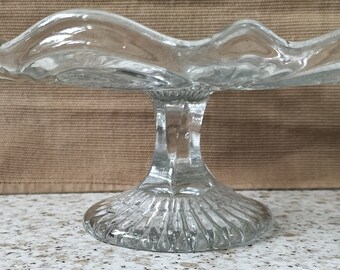 Beautifully etched cake plate on pedestal in clear glass