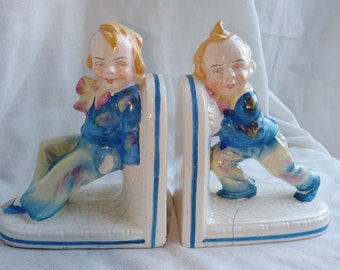 Rare pair of Victorian porcelain bookends, Push and Shove