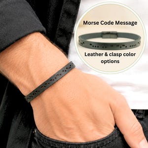 May include: A black leather bracelet featuring a series of cut-out dots and dashes representing a Morse code message. An inset circular graphic displays the bracelet with the text Morse Code Message and Leather & clasp color options.