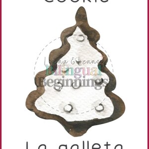 May include: A brown and white cookie shaped like a Christmas tree. The cookie is decorated with white icing and sprinkles. The text "Cookie" is written above the cookie and "La galleta" is written below the cookie.