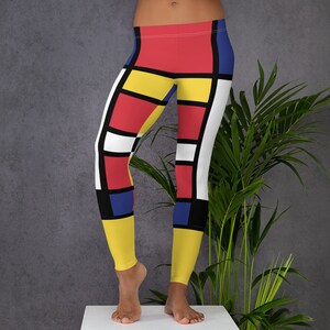 May include: Red, yellow, blue, and white geometric patterned leggings. The leggings are made of a stretchy, comfortable fabric and are perfect for yoga, running, or everyday wear.