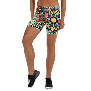 May include: A pair of colorful athletic shorts with a geometric and floral pattern. The shorts are made of a stretchy, comfortable fabric and are perfect for working out or running errands.