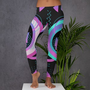 May include: Black leggings with a geometric pattern featuring pink, purple, and turquoise circles and lines.