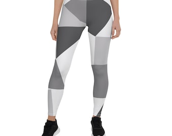 May include: Black and white geometric patterned leggings. The leggings have a white background with black geometric shapes.