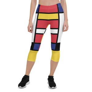 May include: Women's cropped leggings with a geometric pattern in red, yellow, blue, white, and black.