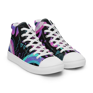 May include: A pair of white high-top canvas sneakers with a black background and a colorful geometric pattern in shades of pink, purple, and blue.
