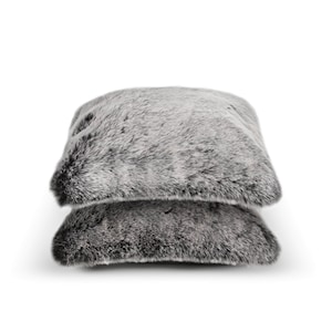 Two plush, silver pillows crafted from premium faux fur offer the perfect addition to your home decor. Ideal when paired with throws, they enhance your living spaces with a stylish blend of comfort, design, and elegance. Perfect for everyday relaxation or as a thoughtful gift, these modern accents elevate any room with a chic and contemporary feel.