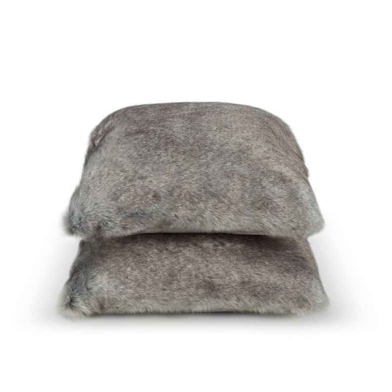 Two luxurious faux fur pillows in elegant shades of grey, designed to enhance your home decor. Perfectly paired with designer blankets, they emphasize interior comfort and timeless elegance while adding a stylish accent to any living space.
