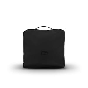 May include: A black travel bag with a top handle and a small rectangular label that reads "Milsen". The bag is square-shaped and appears to be made of a durable material. The bag is designed for carrying items and has a zipper closure.