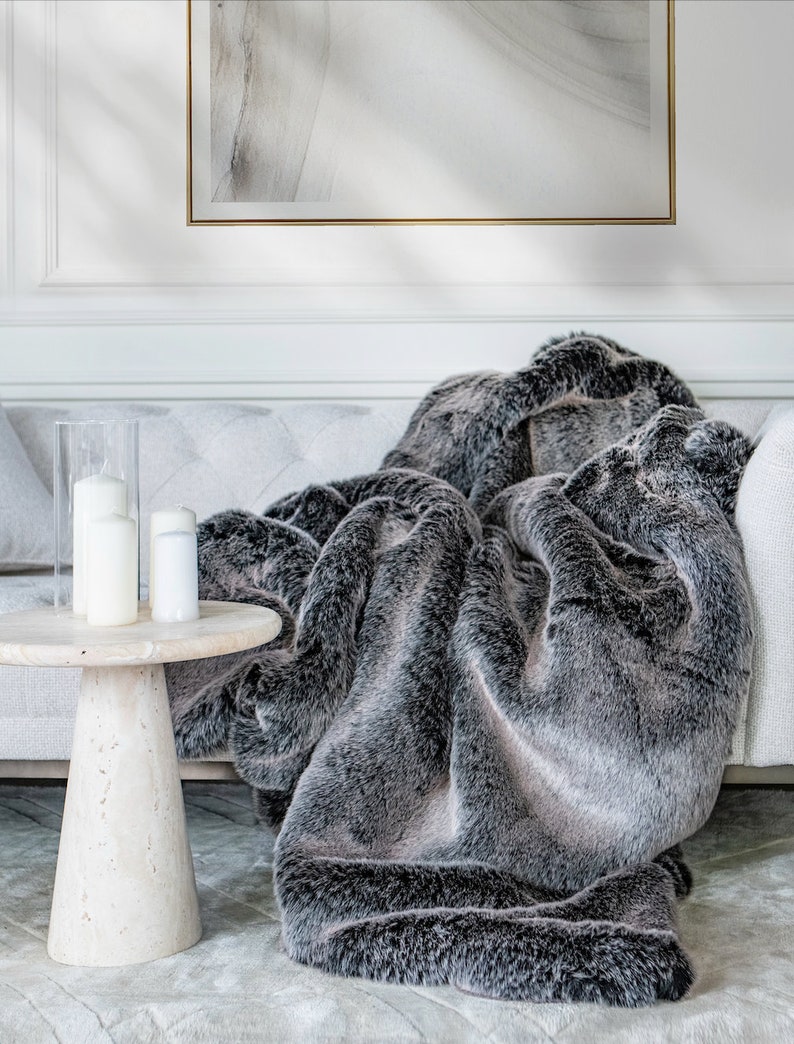 Gray Faux Fur Throw – Comfort, Elegance, and Unique Home Décor for Your Interiors. This luxurious throw, crafted from premium faux fur in sophisticated shades of gray, is the perfect home decoration that brings warmth and refined character to any space. Enhance your living area with a blend of cozy comfort, modern design, and timeless elegance that highlights your unique style.