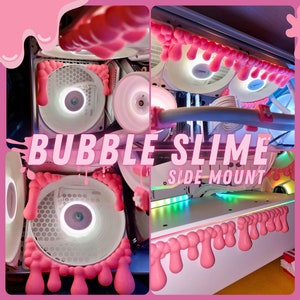 Könnte beinhalten: Ein rosa Computer-Mod im Bubble-Slime-Design mit dem Text "MAGNETIC MOD" und "BUBBLE SLIME SIDE MOUNT". Der Mod ist in den Größen 120x120 oder 140x140 erhältlich.
