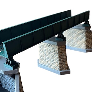 May include: A model train bridge with a green metal structure and stone supports. The bridge is designed for use with model train sets.