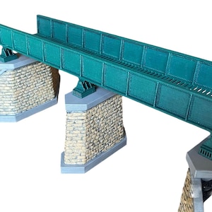 May include: A green metal bridge model with three stone supports. The bridge is made of metal and has a realistic design. The stone supports are made of a light brown material and have a textured surface.