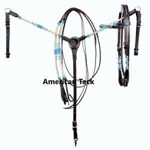 May include: Brown leather horse bridle with turquoise and white beaded reins. The bridle has a browband, noseband, and throatlatch. The reins are attached to the bit.