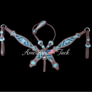 May include: A brown leather horse bridle set with turquoise and silver accents. The set includes a headstall, breast collar, and reins. The headstall and breast collar feature a geometric pattern with turquoise and silver accents. The reins are plain brown leather.