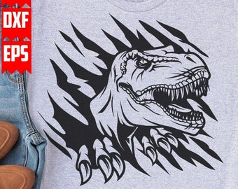 May include: A gray t-shirt with a black and white graphic of a dinosaur head breaking through the fabric. The dinosaur has sharp teeth and claws.