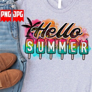 May include: A light gray t-shirt with the words "Hello Summer" in a colorful design. The design includes popsicle illustrations and tropical elements. The shirt is paired with blue denim jeans and brown loafers.
