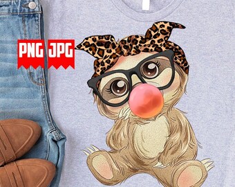 May include: A gray t-shirt with a cartoon sloth wearing a leopard print headband and glasses. The sloth is blowing a pink bubble.