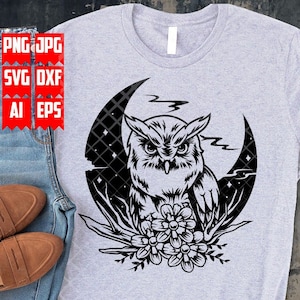 May include: A black and white graphic design of an owl perched on a crescent moon with flowers. The owl has large, round eyes and a beak. The moon is surrounded by stars and clouds.