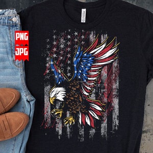 May include: A black t-shirt with a distressed American flag design featuring a bald eagle with its wings spread. The eagle is flying in front of the flag, which has red, white, and blue stripes and stars.