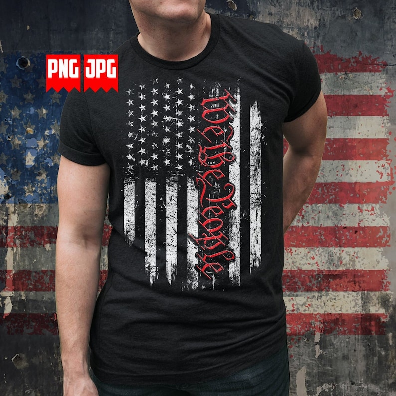 May include: Black t-shirt featuring a distressed American flag design. The flag is rendered in white and black, with the words "We the People" in red script. The shirt has a crew neck and short sleeves.