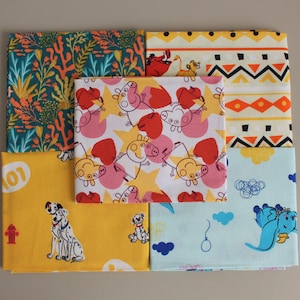 May include: A selection of patterned fabric squares in a variety of designs. The fabrics feature cartoon characters, floral, and geometric patterns. Designs include a Dalmatian dog, Peppa Pig, and characters from The Lion King. The color scheme includes yellow, blue, pink, and orange.