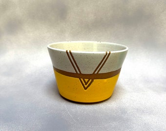 Handmade white and yellow ceramic planter with geometric stripe design, 6" diameter. Great for plants and succulents, with drainage.