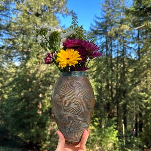 Hand-carved large ceramic vase with interlocking leaf pattern. Turquoise glaze.