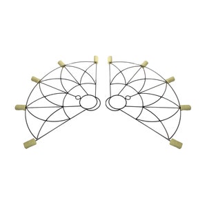May include: Two symmetrical, semi-circular fire fans. Each fan has a black metal frame with a geometric design and several wicks at the ends. The wicks are a light tan colour. The fans are designed for performance or entertainment.