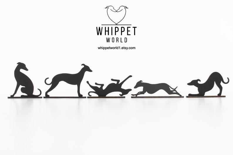 May include: Black metal silhouettes of Whippet dogs in various poses, including sitting, standing, rolling, running, and crouching. The Whippet World logo and website address are at the top.